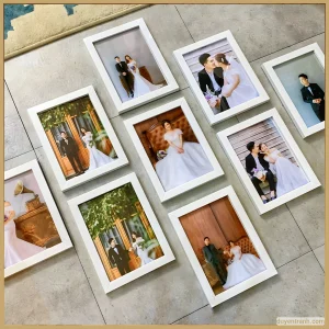 Cặp vợ chồng với khung ảnh trắng